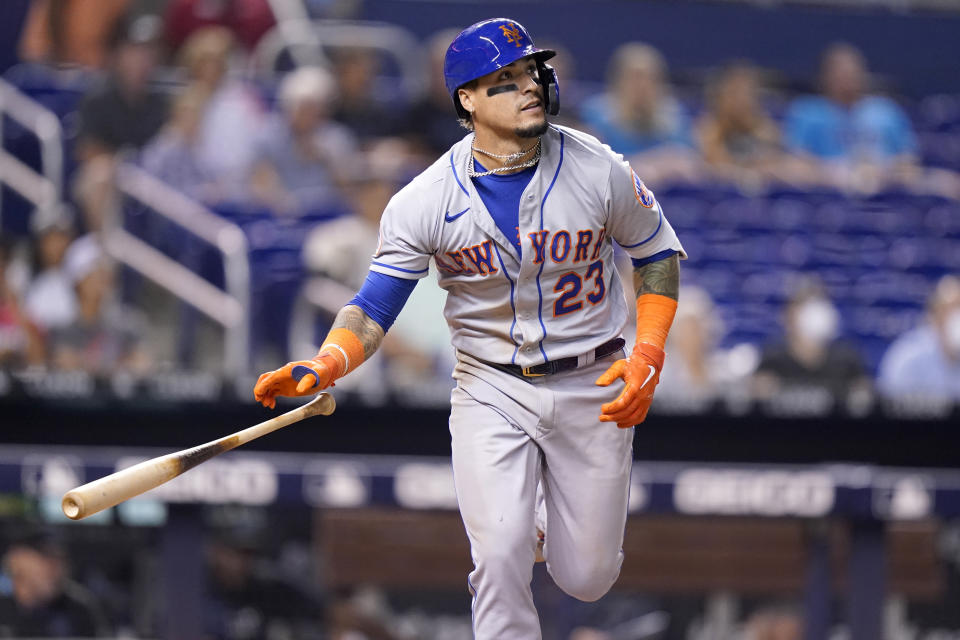 New York Mets' Javier Baez (23) watches after hitting as solo home run during the eighth inning of a baseball game against the Miami Marlins, Wednesday, Aug. 4, 2021, in Miami. The Mets won 5-3. (AP Photo/Lynne Sladky)