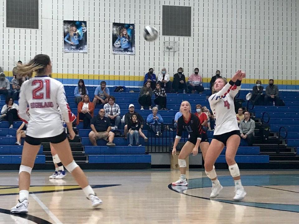 Highland's Zoya Winkelfoos returns a serve by River Valley in a volleyball match in 2021.