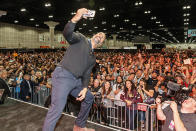 <p>The Rock made sure to take a crowd selfie while attending an event at Stan Lee’s Los Angeles Comic-Con at the Los Angeles Convention Center on Saturday. (Photo: Rich Polk/Getty Images for Entertainment Weekly) </p>