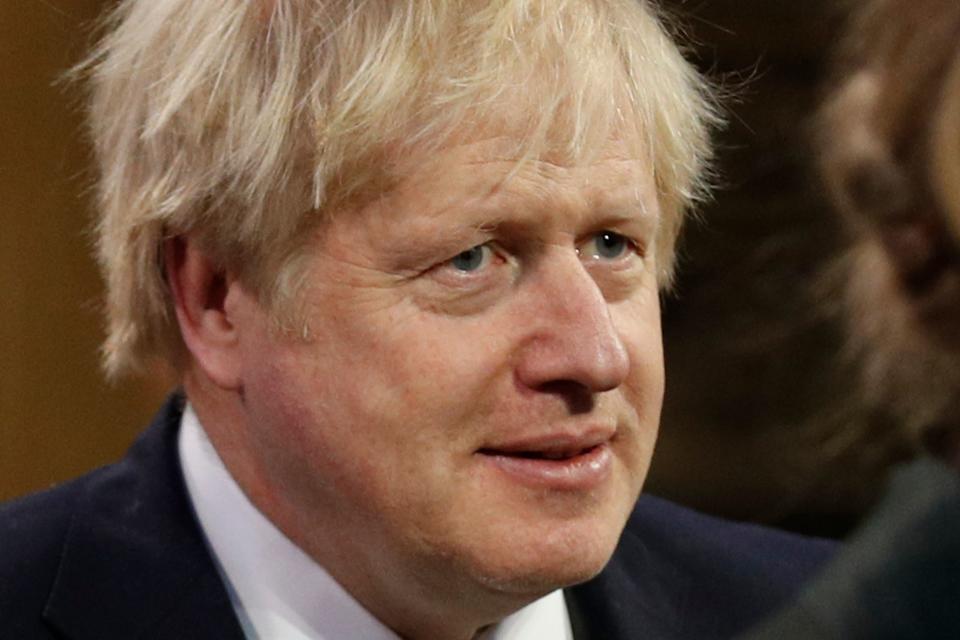 Britain's Prime Minister Boris Johnson processes through the Central Lobby from the Lords chamber back to the House of Commons at the end of the State Opening of Parliament at the Houses of Parliament in London on December 19, 2019. - The State Opening of Parliament is where Queen Elizabeth II performs her ceremonial duty of informing parliament about the government's agenda for the coming year in a Queen's Speech. (Photo by Adrian DENNIS / various sources / AFP) (Photo by ADRIAN DENNIS/AFP via Getty Images)