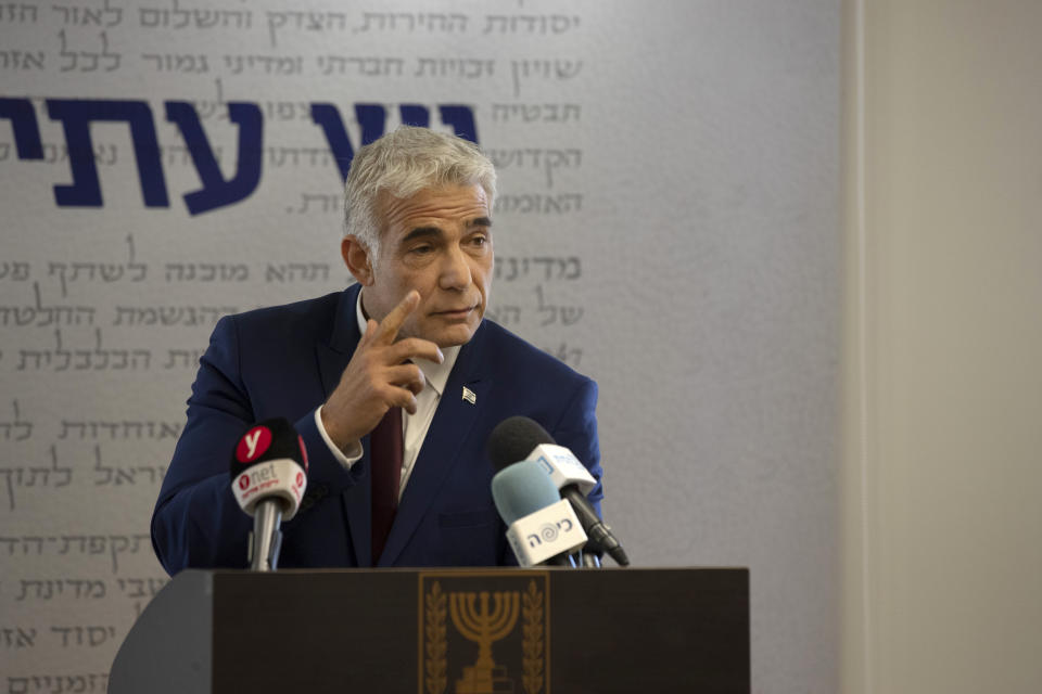 Yesh Atid party leader Yair Lapid speaks to journalists at the Knesset, Israel's Parliament, Monday, June 7, 2021. (AP Photo/Maya Alleruzzo, Pool)