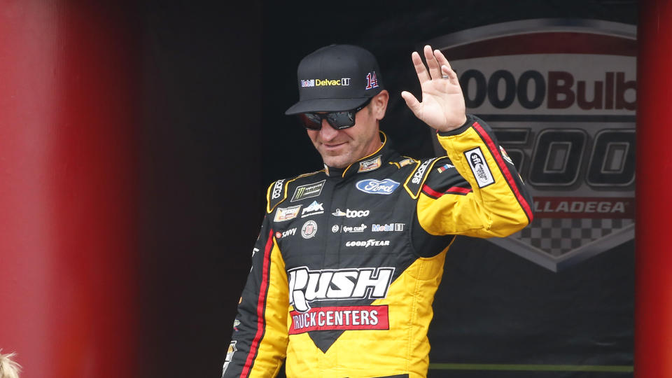 Monster Energy NASCAR Cup Series driver Clint Bowyer (14) waves at driver introductions during a NASCAR Cup Series auto race at Talladega Superspeedway, Sunday, Oct. 14, 2019, in Talladega, Ala. (AP Photo/Butch Dill)