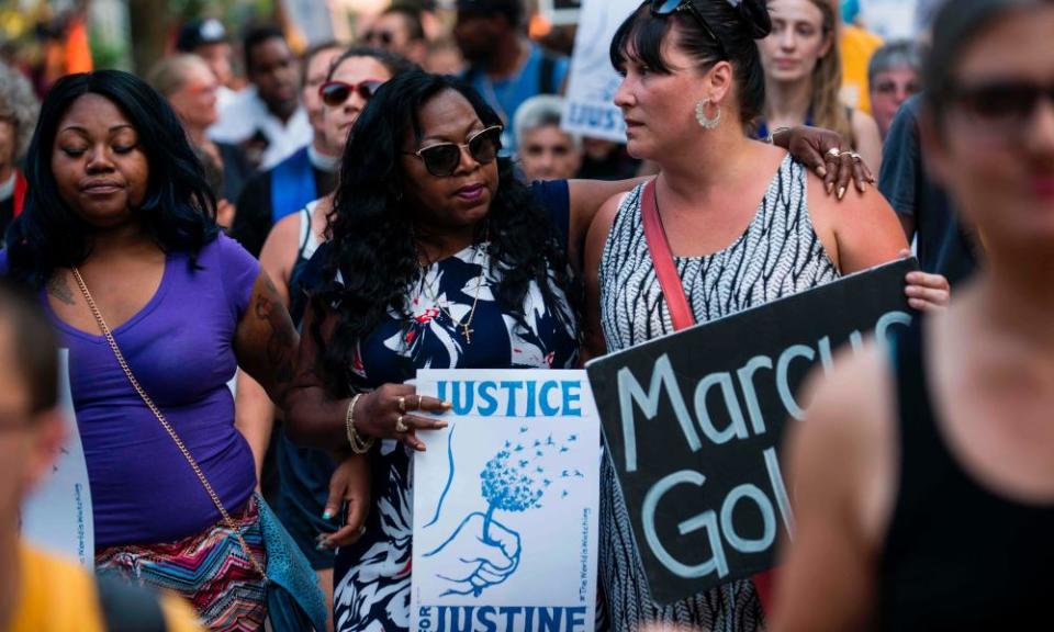 Valerie Castile, centre, mother of shooting Philando Castile, marches in memory of Justine Damond on Thursday in Minneapolis.