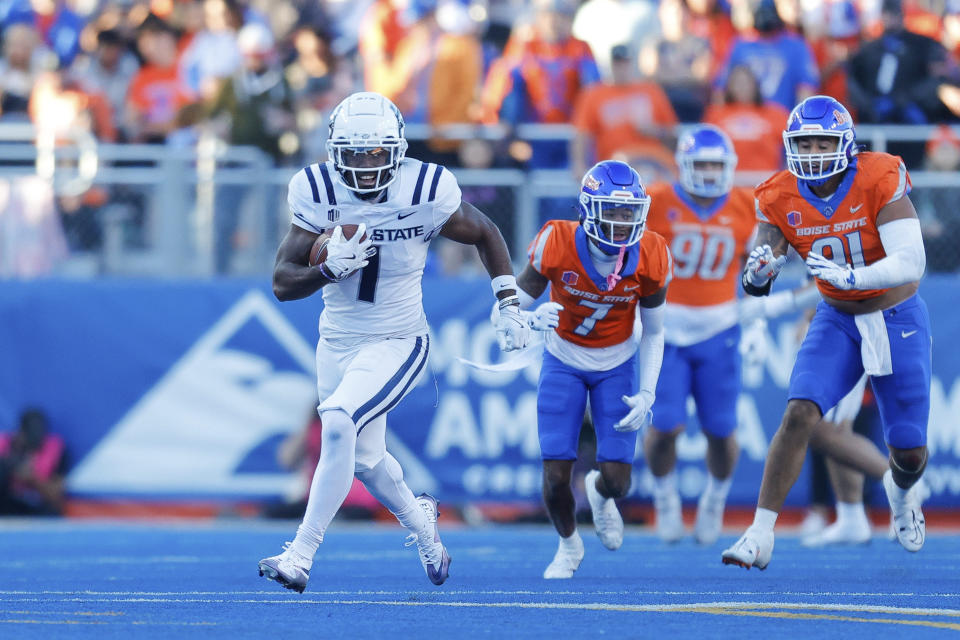 Utah State wide receiver Jalen Royals (1) turns up field after a reception against Boise State in the first half of an NCAA college football game, Saturday, Oct. 5, 2024, in Boise, Idaho. . (AP Photo/Steve Conner)