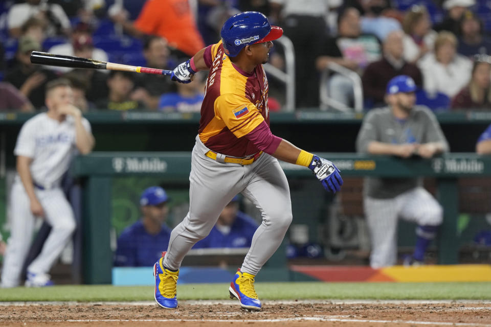 Venezuela third baseman Eduardo Escobar (10) hits a solo home run during the fourth inning of a World Baseball Classic game against Israel, Wednesday, March 15, 2023, in Miami. (AP Photo/Marta Lavandier)