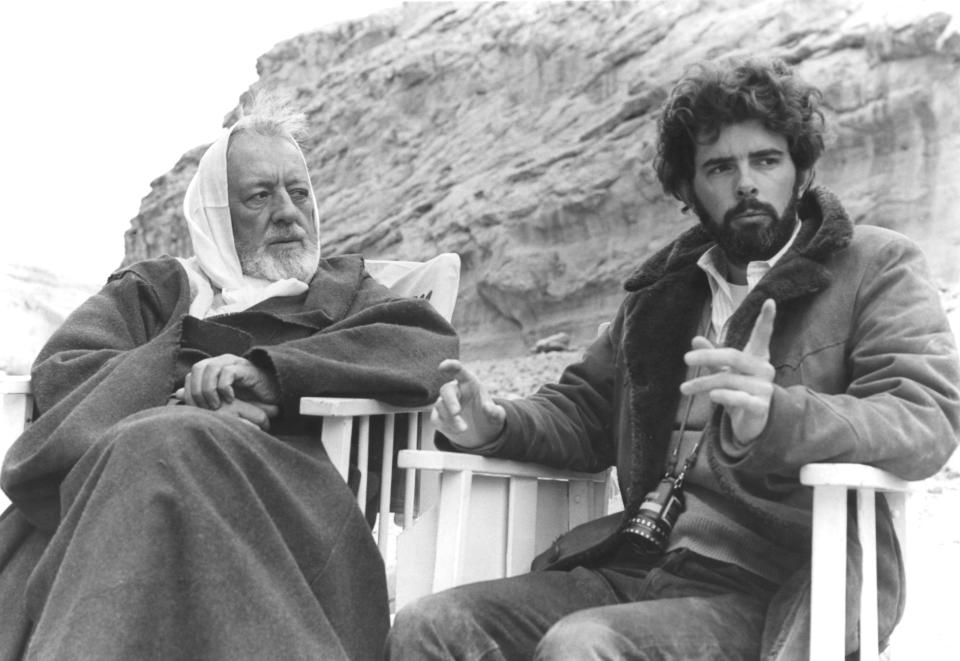 British actor Alec Guinness with American director, screenwriter and producer George Lucas on the set of his movie Star Wars: Episode IV - A New Hope. (Photo by Sunset Boulevard/Corbis via Getty Images)