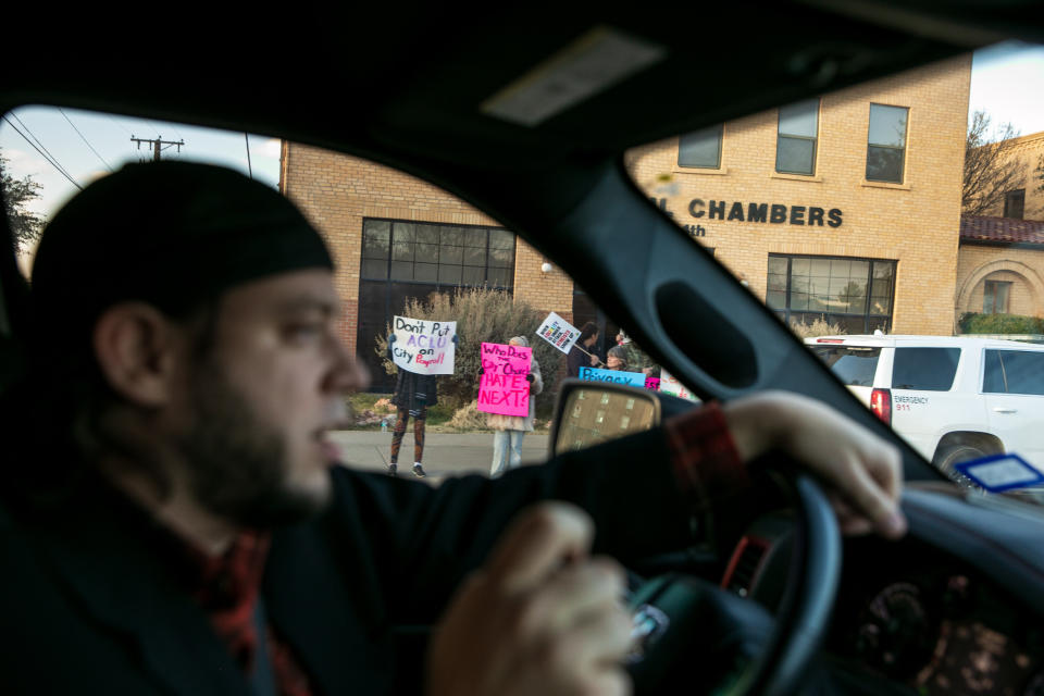 Mark Lee Dickson drives by a group of people protesting the proposed abortion ban.&nbsp; (Photo: Ilana Panich-Linsman for HuffPost)