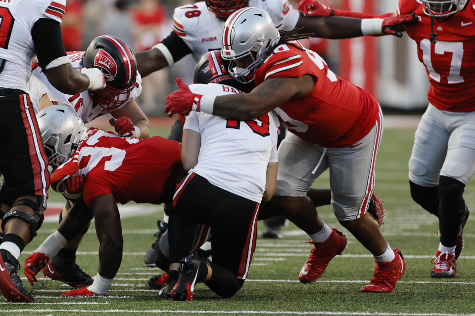 Ohio State defensive lineman Jaden McKenzie, right, sacks Western Kentucky quarterback Bronson Barron during the second half of an NCAA college football game, Saturday, Sept. 16, 2023, in Columbus, Ohio. (AP Photo/Jay LaPrete)