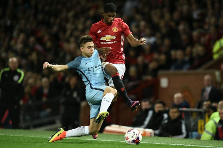 Manchester City manager Pep Guardiola did not field his strongest side at Old Trafford in midweek, making nine changes and fielding 19-year-olds Pablo Maffeo (L)