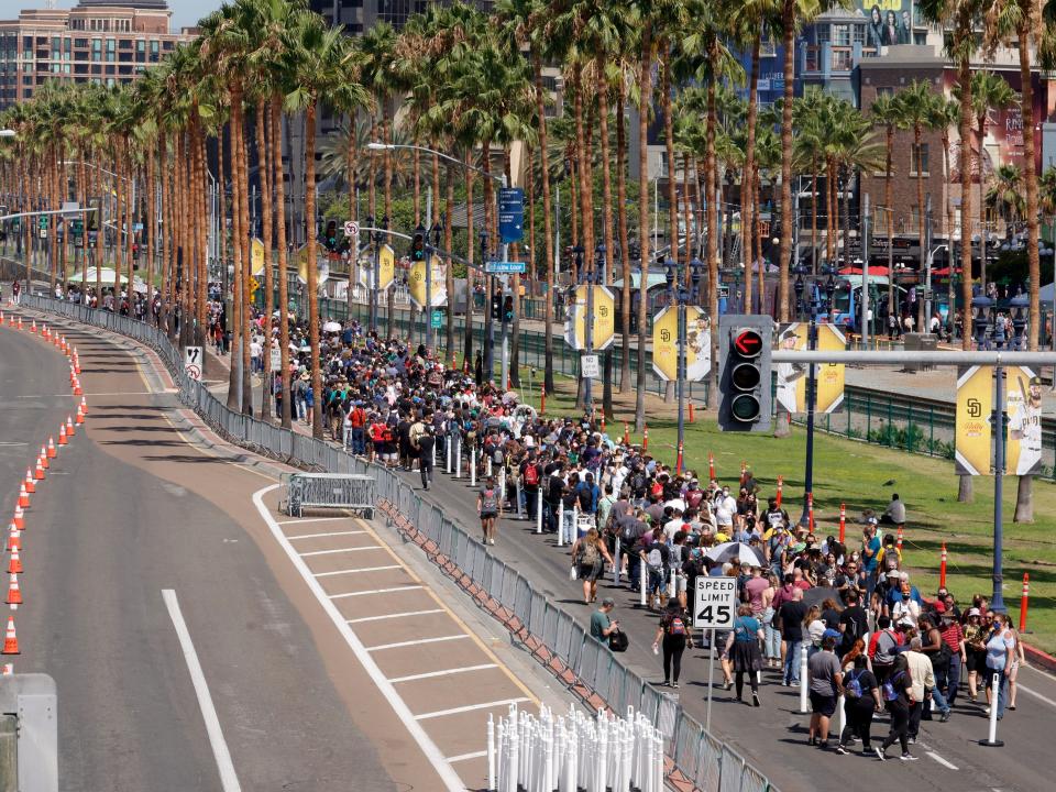 A long line of San Diego Comic-Con fans waiting on line to get COVID vaccine wristbands.