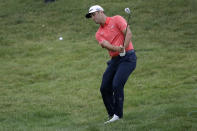 FILE - Jon Rahm, of Spain, chips for birdie on the 16th hole during the final round of the Memorial golf tournament in Dublin, Ohio, in this Sunday, July 19, 2020, file photo. Rahm hit the most memorable shot all year with a lob wedge. (AP Photo/Darron Cummings, File)