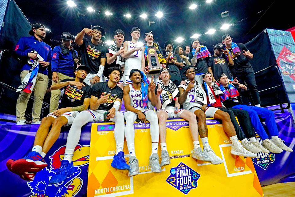 Kansas celebrates after beating North Carolina in the championship game of the 2022 NCAA men's basketball tournament at Caesars Superdome in New Orleans