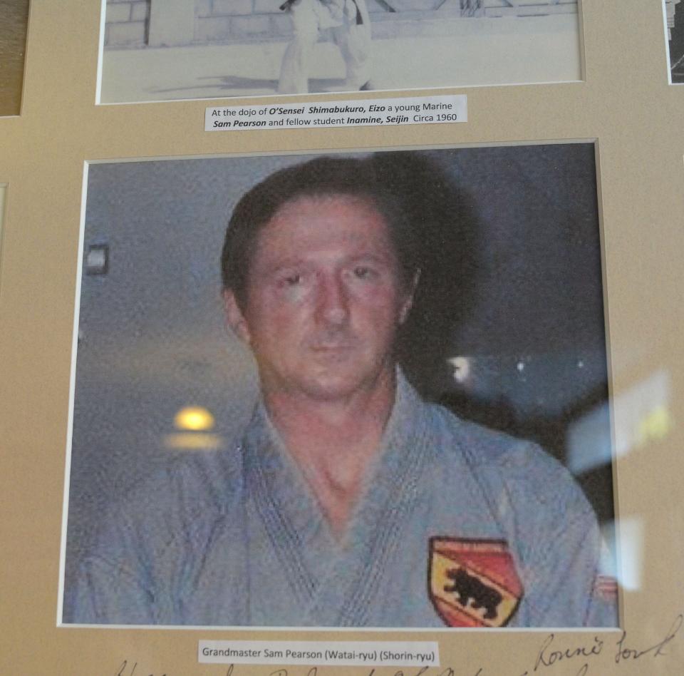 A photo of school founder Sam Pearson hangs on the wall at the New Bern School of Martial Arts, the oldest active karate school in Craven County.