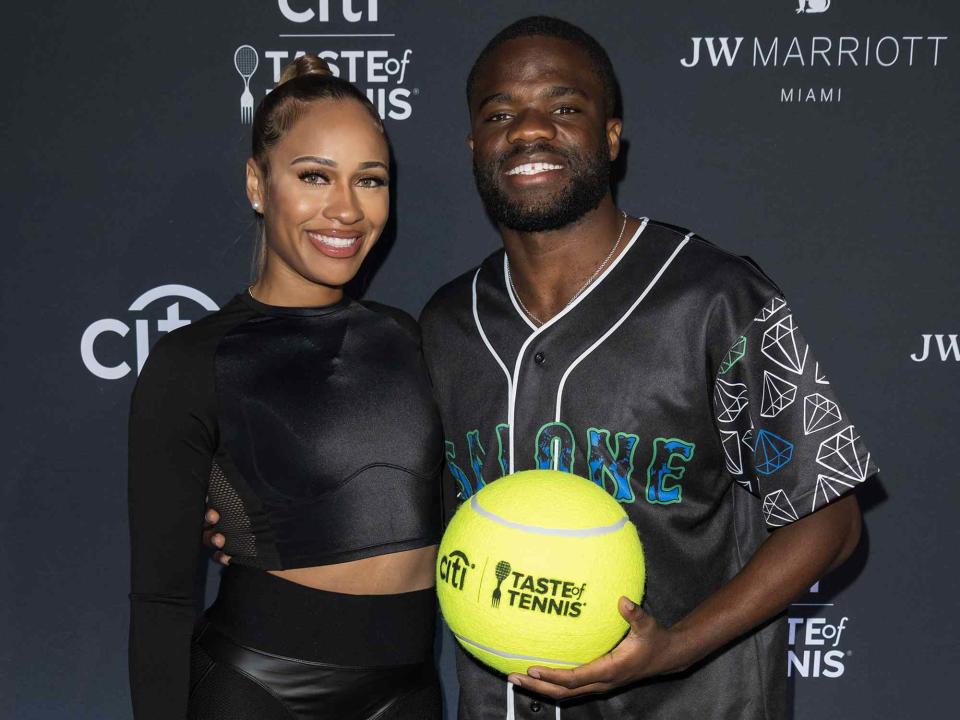 <p>Jason Koerner/Getty</p> Ayan Broomfield and Frances Tiafoe attend Citi Taste of Tennis Miami 2023