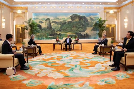 Chinese Premier Li Keqiang meets South Korean Foreign Minister Kang Kyung-wha and Japanese Foreign Minister Taro Kono (L) with Chinese Foreign Minister Wang Yi at the Great Hall of the People (GHOP) in Beijing