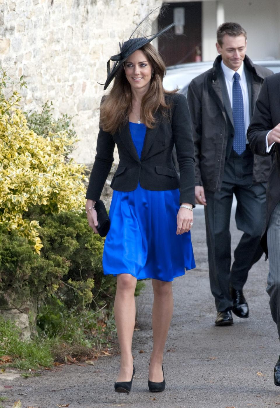 <p>Kate paired a neat black blazer with an electric blue Issa dress for a wedding in 2010. <em>(Photo: PA)</em> </p>