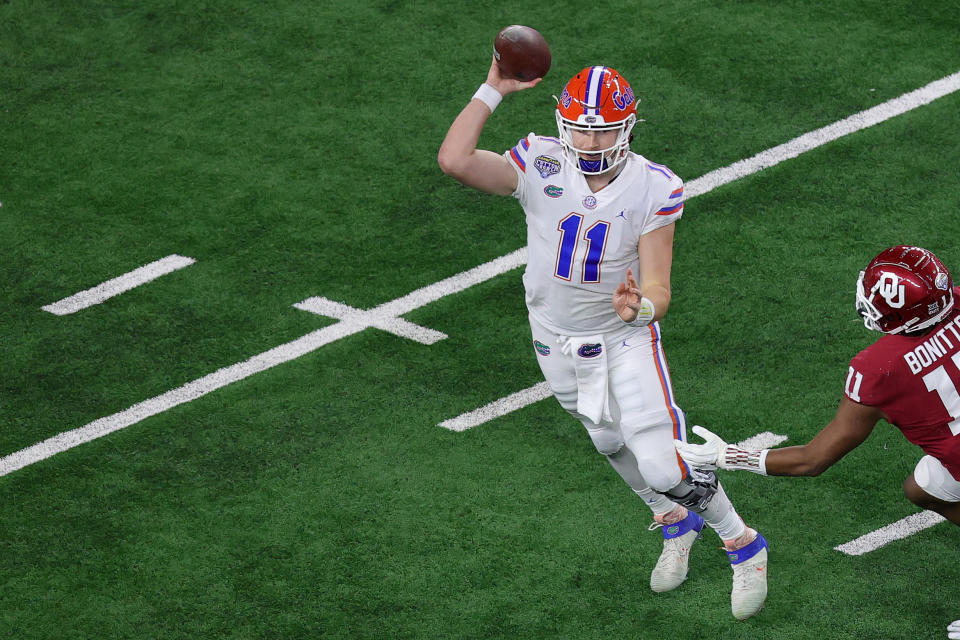 ARLINGTON, TEXAS - DECEMBER 30: Quarterback Kyle Trask #11 of the Florida Gators throws against the Oklahoma Sooners during the second quarter at AT&T Stadium on December 30, 2020 in Arlington, Texas. (Photo by Carmen Mandato/Getty Images)