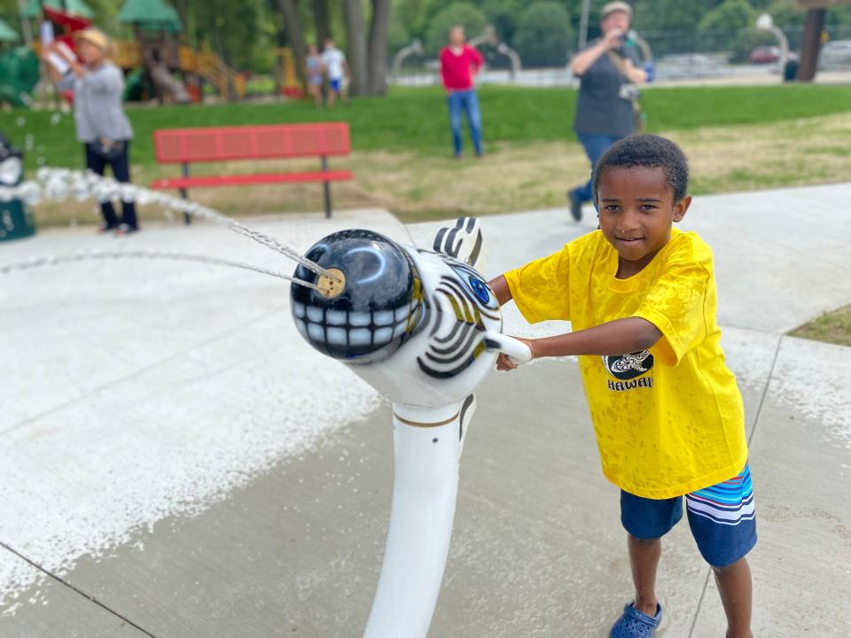 Kayden Wardell, 5, uses a zebra blaster during the unveiling of the Wet Safari Splash Pad at Claude Evans Park Saturday, July 10, 2021, in Battle Creek.