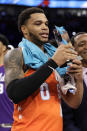 U.S. forward Miles Bridges, of the Charlotte Hornets, holds the MVP trophy after the NBA Rising Stars basketball game in Chicago, Friday, Feb. 14, 2020. (AP Photo/Nam Y. Huh)