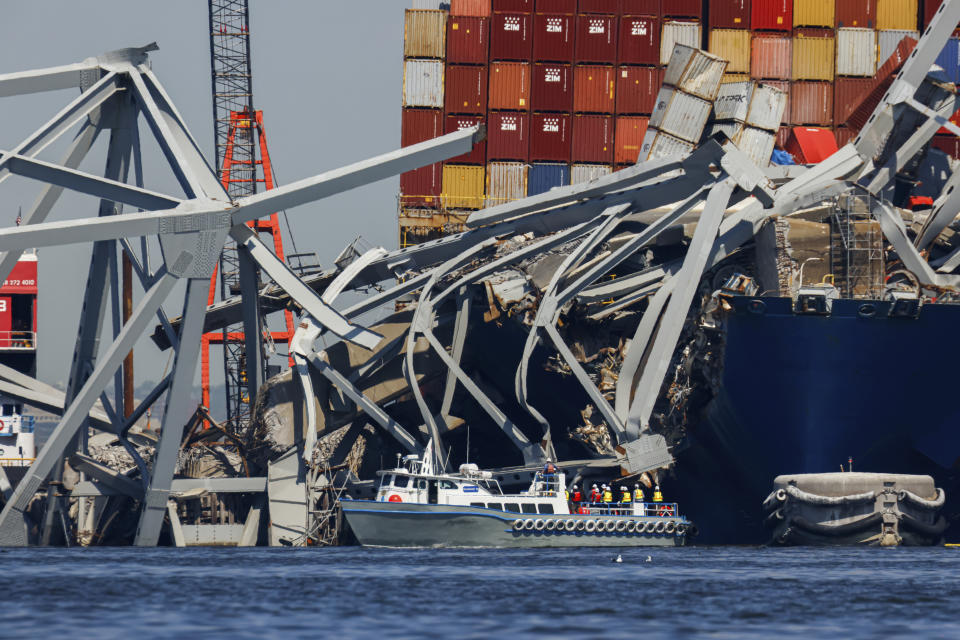 Salvage work continues on the collapsed Francis Scott Key Bridge, Monday, April 15, 2024, in Baltimore. The FBI confirmed that agents were aboard the Dali conducting court-authorized law enforcement activity. (AP Photo/Julia Nikhinson)