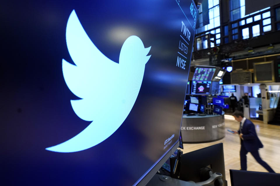 FILE - The logo for Twitter appears above a trading post on the floor of the New York Stock Exchange, Nov. 29, 2021. Twitter's stock slid more than 6% before the market open Monday, July 11, 2022, after billionaire Elon Musk announced late Friday that he will abandon his $44 billion offer to buy Twitter and the company said it will sue the Tesla CEO to uphold the deal. (AP Photo/Richard Drew, File)