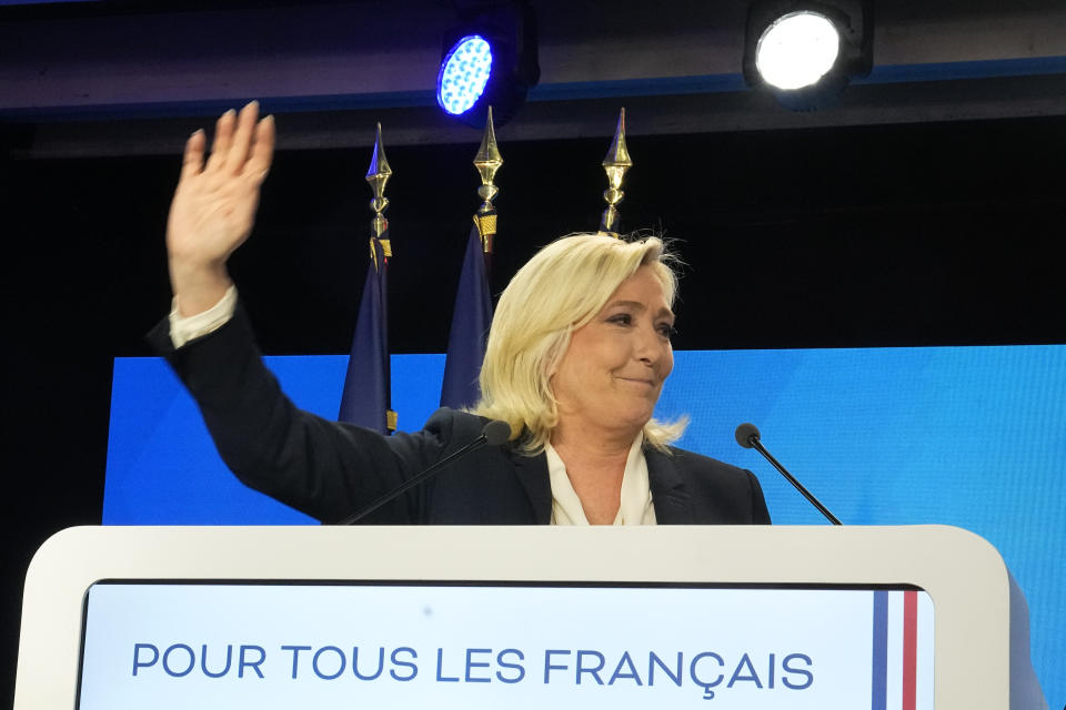 Far-right leader Marine Le Pen gestures after speaking after the early result projections of the French presidential election runoff were announced in Paris, Sunday, April 24, 2022. French polling agencies are projecting that centrist incumbent Emmanuel Macron will win France's presidential runoff Sunday, beating far-right rival Marine Le Pen in a tight race that was clouded by the Ukraine war and saw a surge in support for extremist ideas. (AP Photo/Michel Euler)