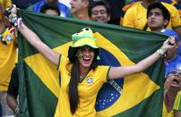 A Brazil fan cheers before the 2014 World Cup quarter-finals between Brazil and Colombia at the Castelao arena in Fortaleza July 4, 2014. REUTERS/Jorge Silva