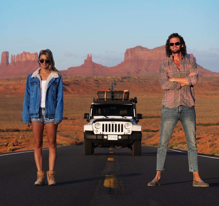 New Zealand social media influencers Topher Richwhite and Bridget Thackwray in front of their Jeep on a trip. 