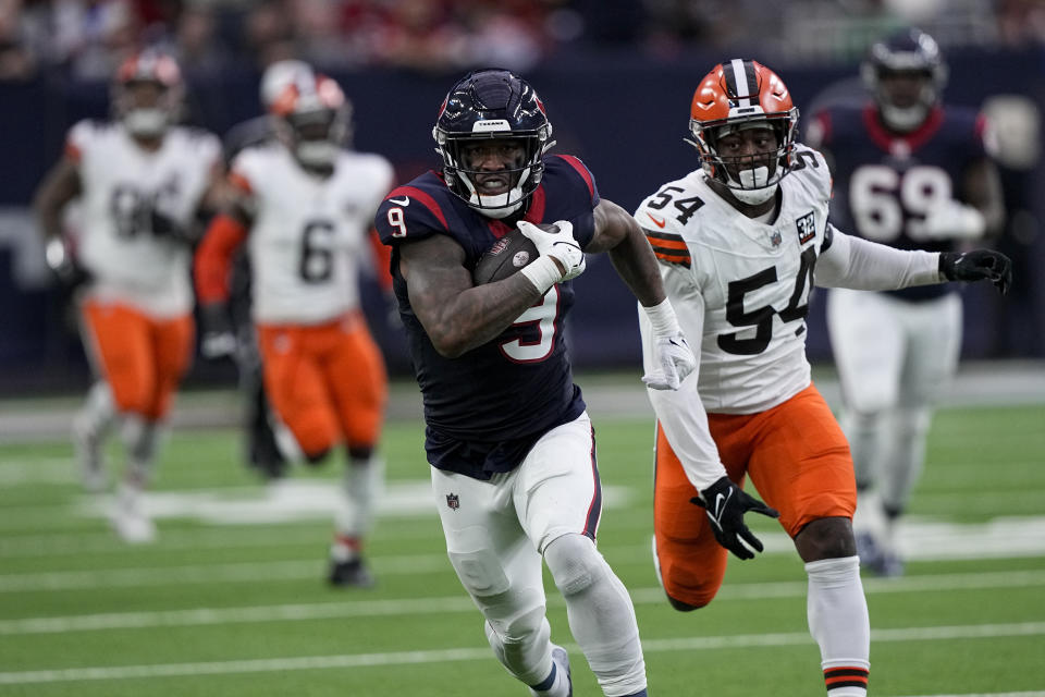 Houston Texans tight end Brevin Jordan runs for a touchdown against the Cleveland Browns during the first half of an NFL wild-card playoff football game Saturday, Jan. 13, 2024, in Houston. (AP Photo/David J. Phillip)