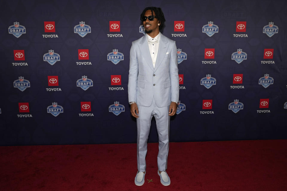 LSU quarterback Jayden Daniels poses on the red carpet ahead of the first round of the NFL football draft, Thursday, April 25, 2024, in Detroit. (AP Photo/Carlos Osorio)