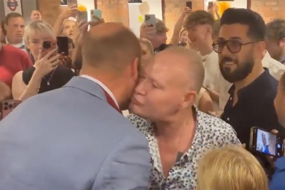 Gazza moves in for the kiss on the future king (Pool)