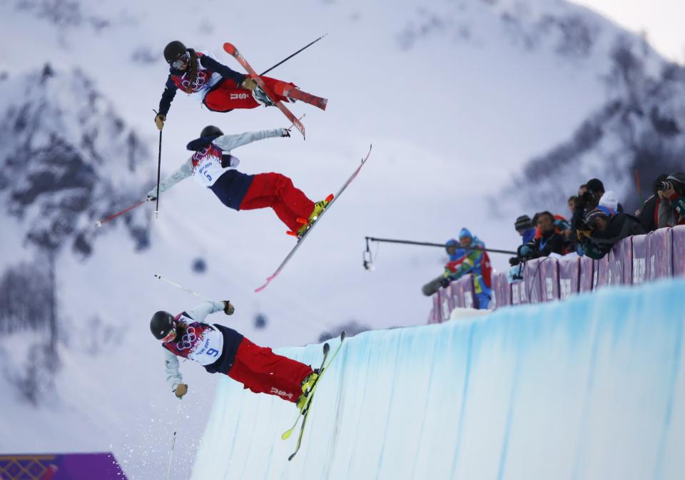 Annalisa Drew, Brita Sigourney (C) and Maddie Bowman of the U.S. (top) practice during warm sessions ahead of the women's freestyle skiing halfpipe qualification round at the 2014 Sochi Winter Olympic Games in Rosa Khutor February 20, 2014. REUTERS/Mike Blake (RUSSIA - Tags: SPORT OLYMPICS SPORT SKIING TPX IMAGES OF THE DAY)