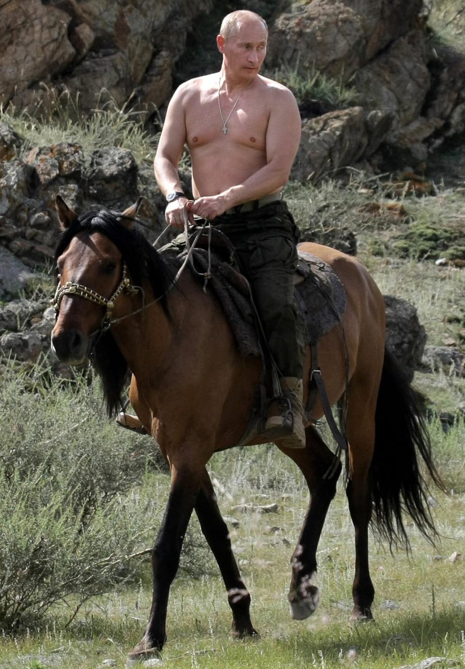 Russian Prime Minister Vladimir Putin rides a horse during his vacation outside the town of Kyzyl in Southern Siberia