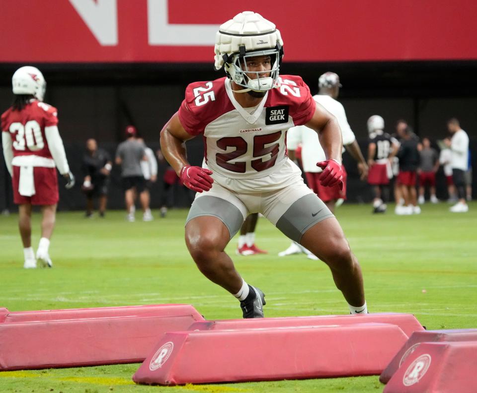 Jul 27, 2022; Glendale, AZ, USA;  Arizona Cardinals inside linebacker Zaven Collins (25) runs a drill during training camp at State Farm Stadium.