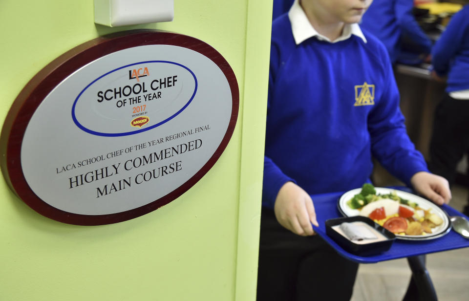 A view of School Chef of the Year Highly Commended Award plague at Hillstone Primary School, in Birmingham, England, Wednesday, Nov. 30, 2022. For some children in low-income areas in England, a school lunch may be the only nutritious hot meal they get in a day. School lunches are given for free to all younger children in England and to some of the poorest families. But the Food Foundation charity estimates that there are 800,000 children in England living in poverty who are not eligible for the free meals. (AP Photo/Rui Vieira)