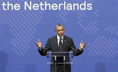 U.S. President Barack Obama gestures as he addresses a news conference at the end of the Nuclear Security Summit in The Hague March 25, 2014. REUTERS/Francois Lenoir