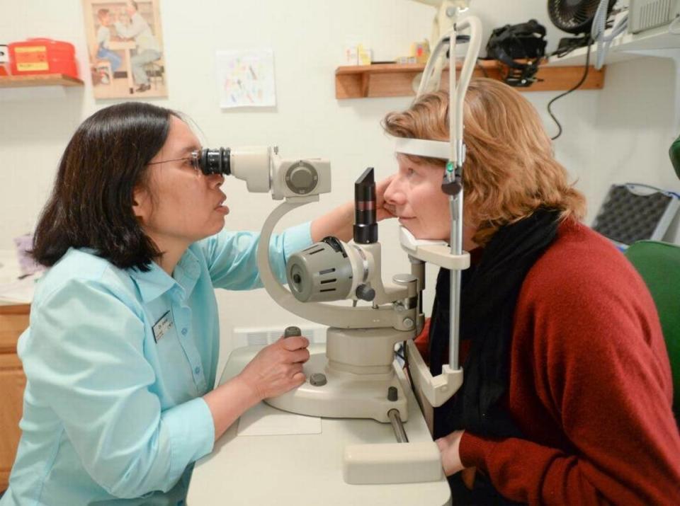 Optometrist Darlene Anker gives Barb Roy an eye exam at the Frank Haskell Lions Eye Clinic at the Lighthouse Mission in Bellingham, Washington. Washington optometrists can’t perform laser eye surgery.