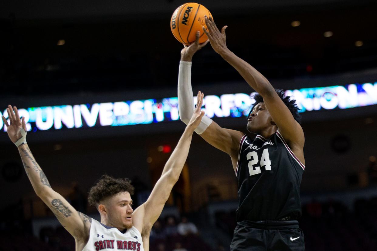 Santa Clara guard Jalen Williams (24) shoots against Saint Mary's guard Logan Johnson, left, during the second half of an NCAA semifinal college basketball game at the West Coast Conference tournament Monday, March 7, 2022, in Las Vegas. (AP Photo/Ellen Schmidt)