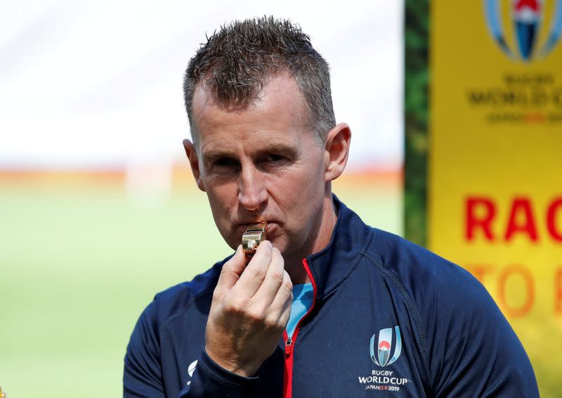 FILE PHOTO: Referee Nigel Owen holds up the whistle to be used in the opening match of the Rugby World Cup, in Tokyo