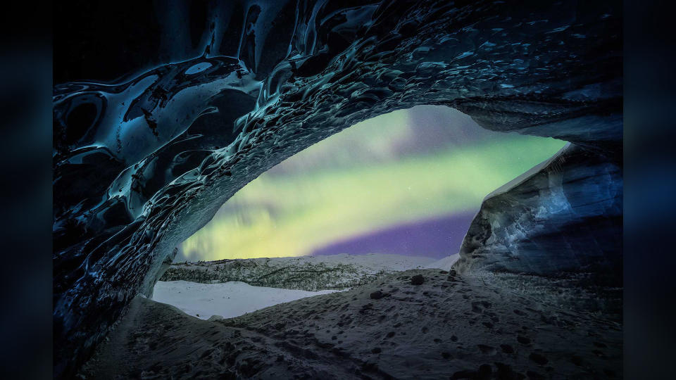 Purple and green northern lights over Alaska, USA.