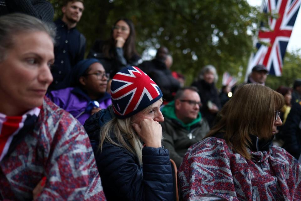 People gather on the day of the state funeral and burial of Britain’s Queen Elizabeth (REUTERS)