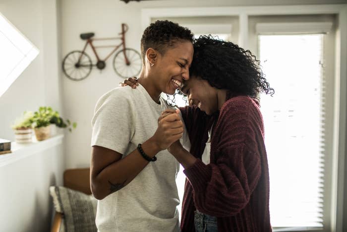 a couple dancing in their home