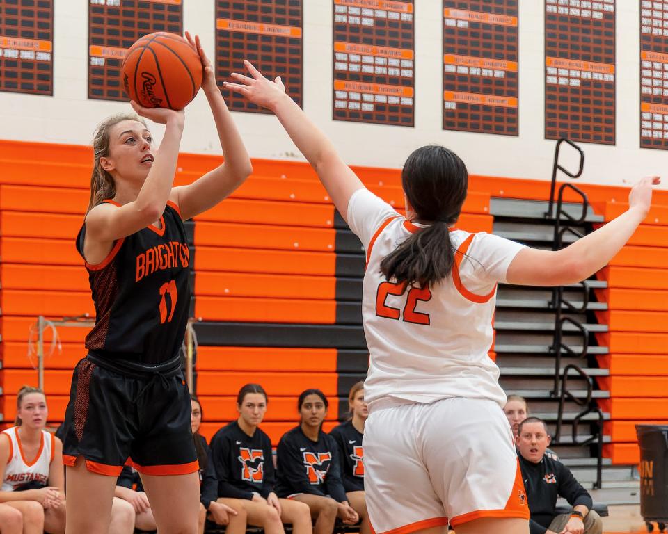 Brighton's Makena Smith, who scored a career-high 16 points, shoots over Northville's Nikki Grech during the Bulldogs' 43-41 victory on Friday, Jan. 13, 2023.