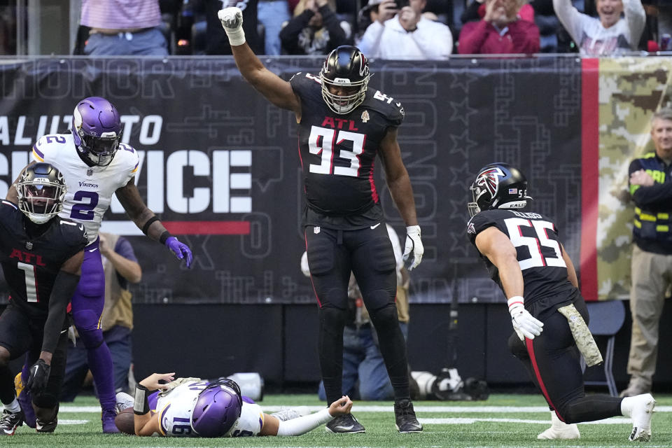 Minnesota Vikings quarterback Jaren Hall, center, lies on the field injured after being tackled short of the goal line during the first half of an NFL football game against the Atlanta Falcons, Sunday, Nov. 5, 2023, in Atlanta. (AP Photo/John Bazemore)