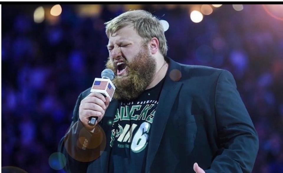 Ben Tajnai, sings the national anthem before a Milwaukee Bucks game.