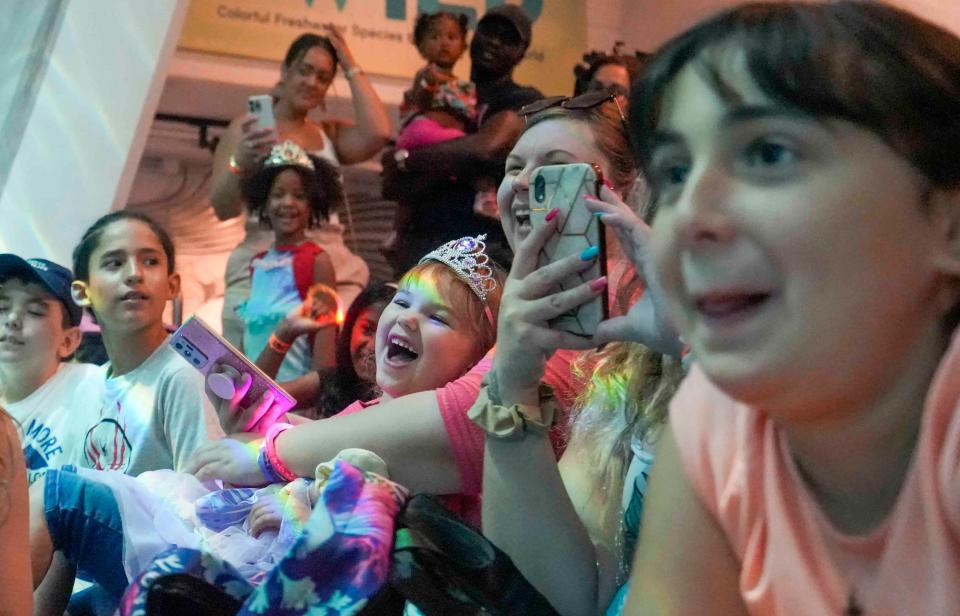 Kids get a kick out of lessons at Discovery World presented by Claire Van Valkenburg, a UWM graduate who performs as Mermaid Echo. She teaches about freshwater science and conservation.