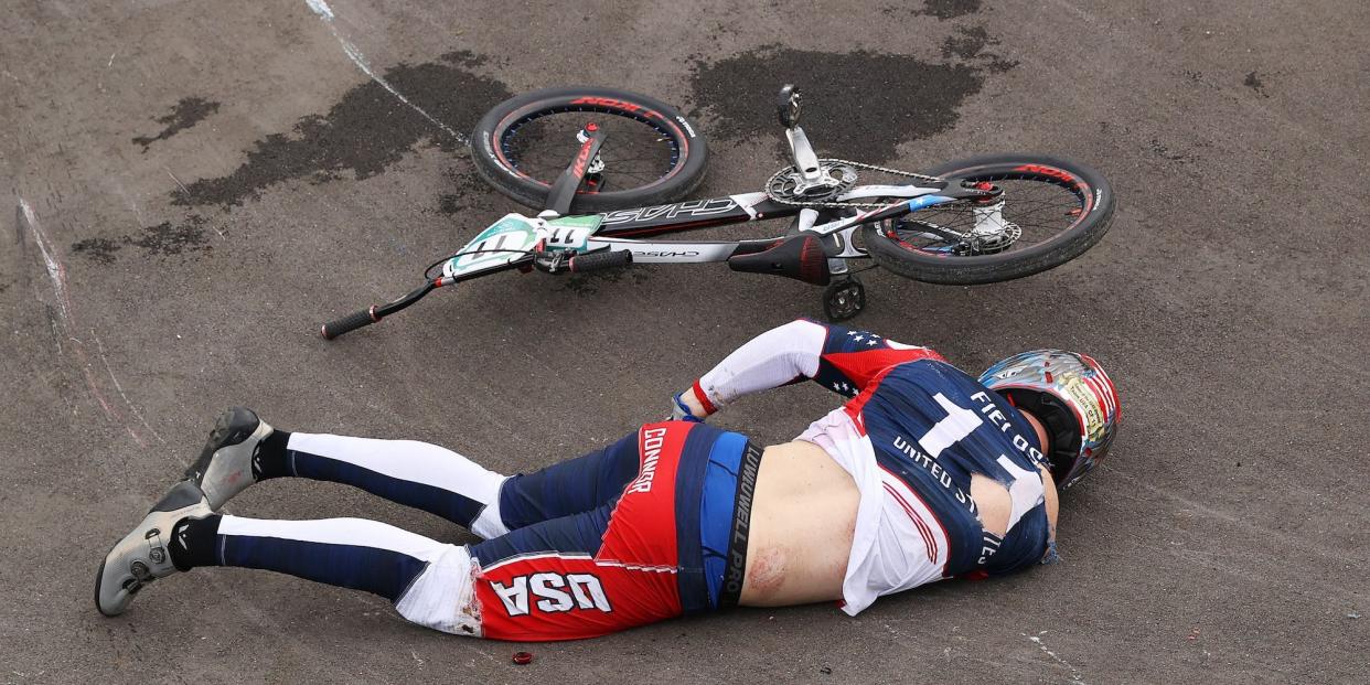 Connor Fields lays on the ground after a crash at the Olympics.