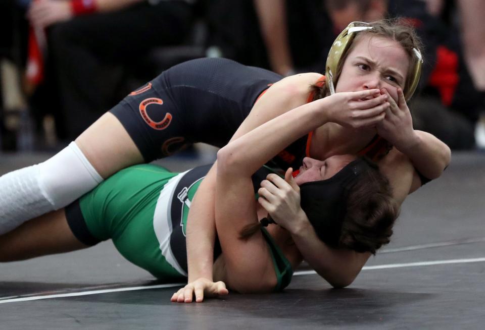 Columbia's Sarah Napier tries to fend off Delaware Hayes' Molly Wells in a 110-pound match at the OHSWCA girls state wrestling tournament.