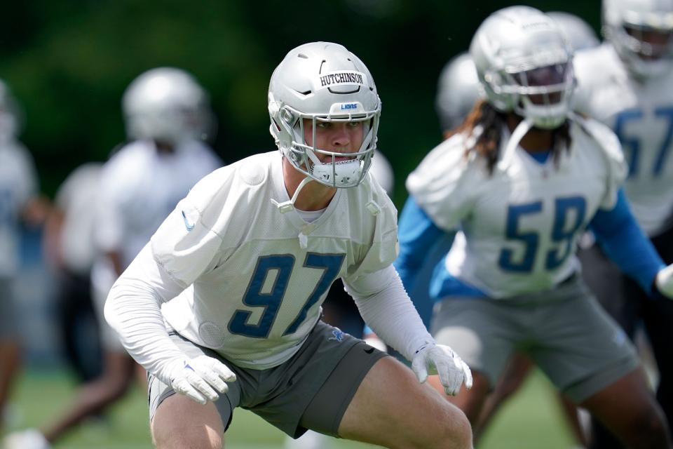 Detroit Lions defensive end Aidan Hutchinson runs a drill during practice in Allen Park, Thursday, June 9, 2022.