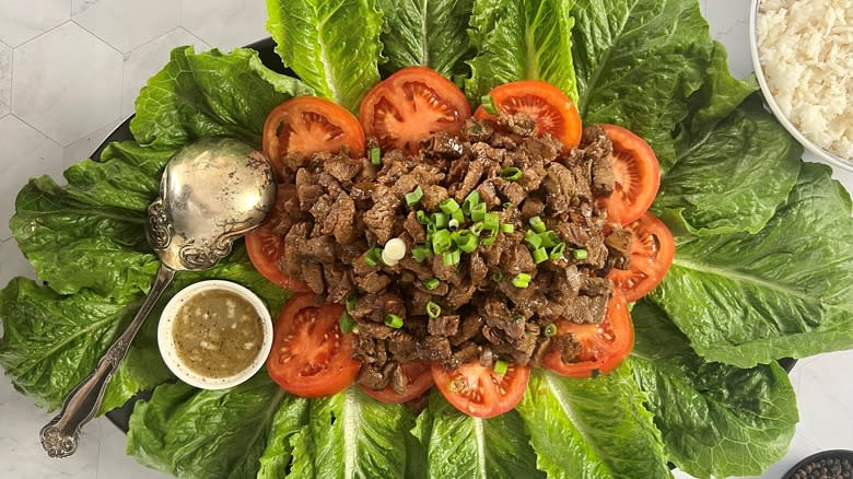 lok lak beef stir-fry with lettuce and tomatoes